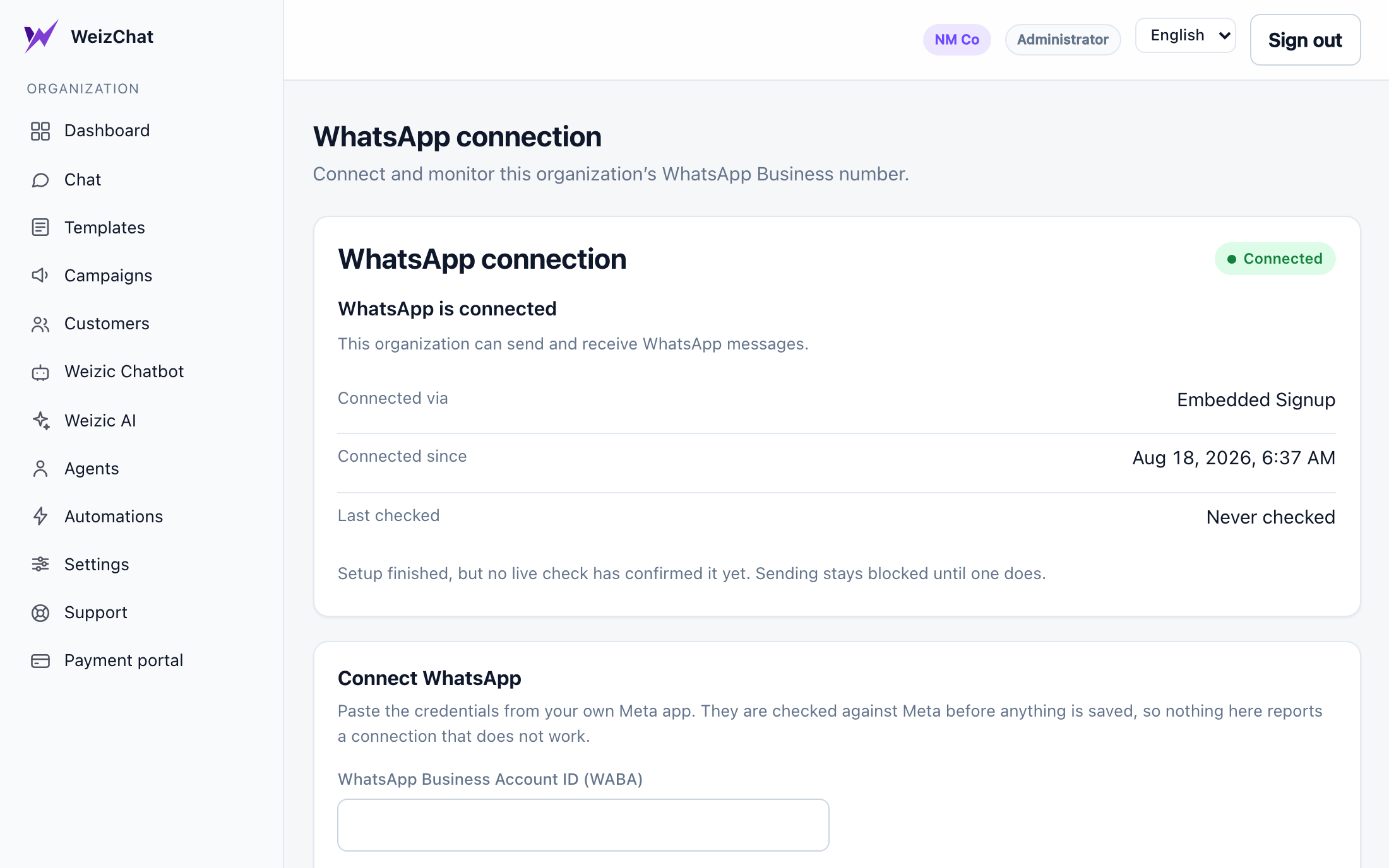 The WhatsApp connection page: a connected number and write-only credential fields.